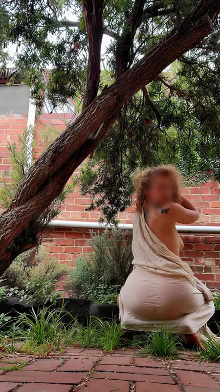 Nude massage Melbourne, masseuse Alice draped in fabric in a Melbourne garden Nude massage Melbourne, masseuse Alice draped in fabric in a Melbourne garden