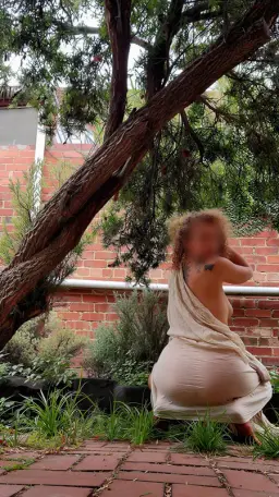 Nude massage Melbourne, masseuse Alice draped in fabric in a Melbourne garden Nude massage Melbourne, masseuse Alice draped in fabric in a Melbourne garden