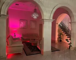 Adelaide massage parlour lounge with arches, chandelier and pink lighting Adelaide massage parlour lounge with arches, chandelier and pink lighting