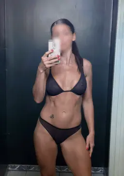 Melbourne erotic massage, fit masseuse in sheer black lingerie Melbourne erotic massage, fit masseuse in sheer black lingerie
